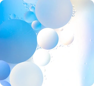 Translucent white and blue bubble-like shapes floating in soft light.